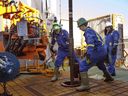 Precision Drilling Corp. has signed an agreement to acquire CWC Energy Services Corp. in a deal valued at about $141 million including shares, cash and assumed debt. Trainees Dan Brook and Bradley Williams are directed by instructor Clint Dyck while training to lay down drill pipe on a rig floor, at Precision Drilling in Nisku, Alta., on January 20, 2016.